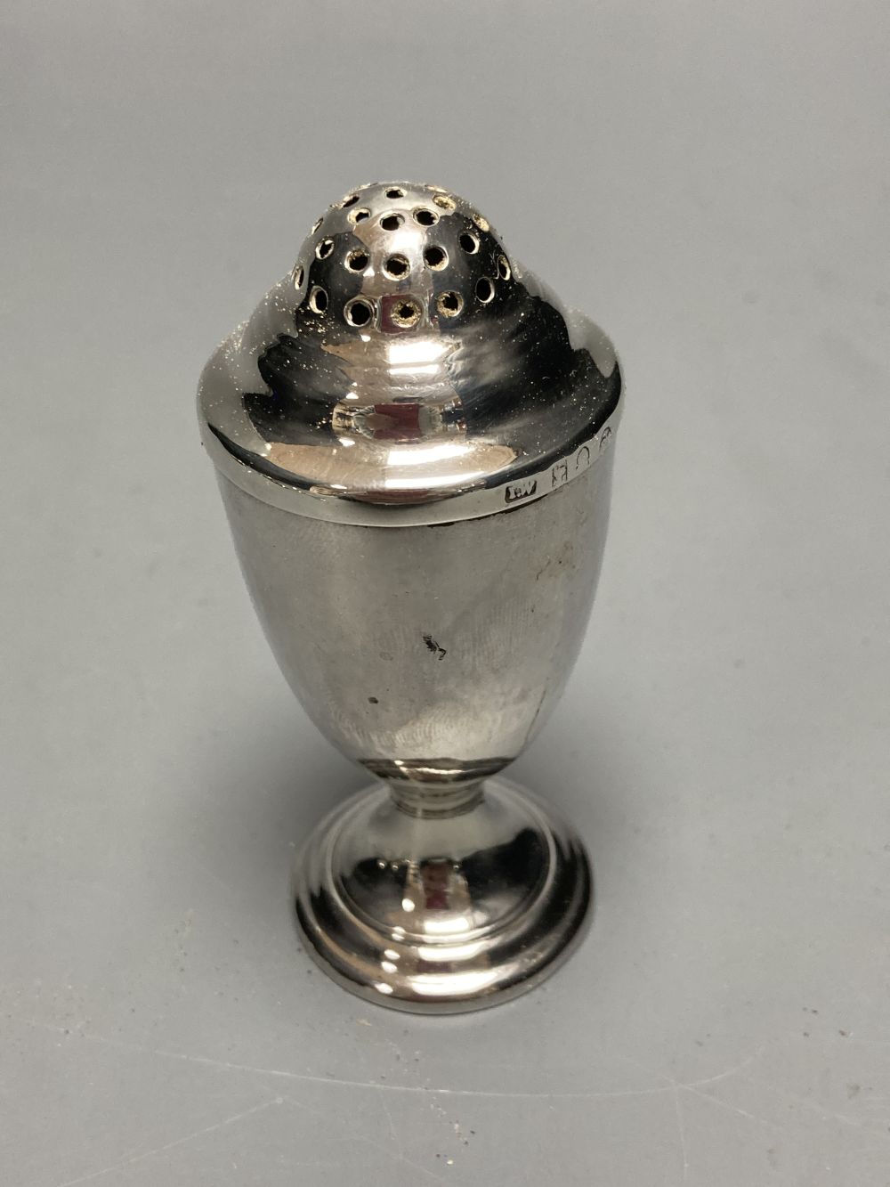 A pair of Georgian silver circular salts, a George III urn-shaped pepper pot and 4 various spoons.